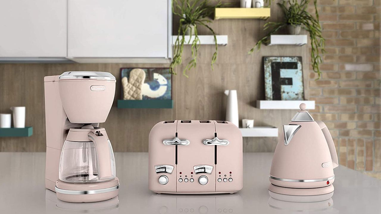 De&#039;Longhi Argento Flora drip pink Coffee Machine on worktop beside matching kettle and toaster