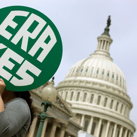 washington, dc march 22 a woman hold up a sign as members of congress and representatives of womens groups hold a rally to mark the 40th anniversary of congressional passage of the equal rights amendment era outside the us capitol march 22, 2012 in washington, dc rep carolyn maloney d ny and sen robert menendez d nj introduced a new version of the equal rights amendment last year and called for it to be passed again photo by chip somodevillagetty images