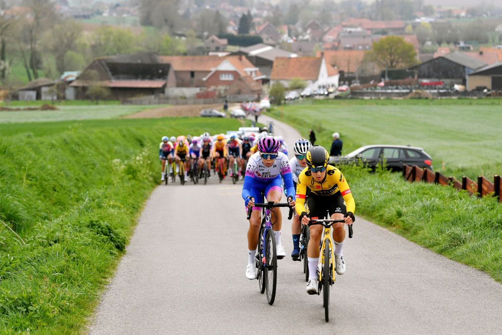 WAREGEM BELGIUM MARCH 30 A general view of Jelena Eric of Serbia and Movistar Team Georgia Baker of Australia and Team BikeExchange Jayco and Amber Kraak of Netherlands and Jumbo Visma Team attack in the peloton during the 10th Dwars door Vlaanderen 2022 Womens Elite a 120km one day race from Waregem to Waregem DDV22 DDVwomen on March 30 2022 in Waregem Belgium Photo by Luc ClaessenGetty Images