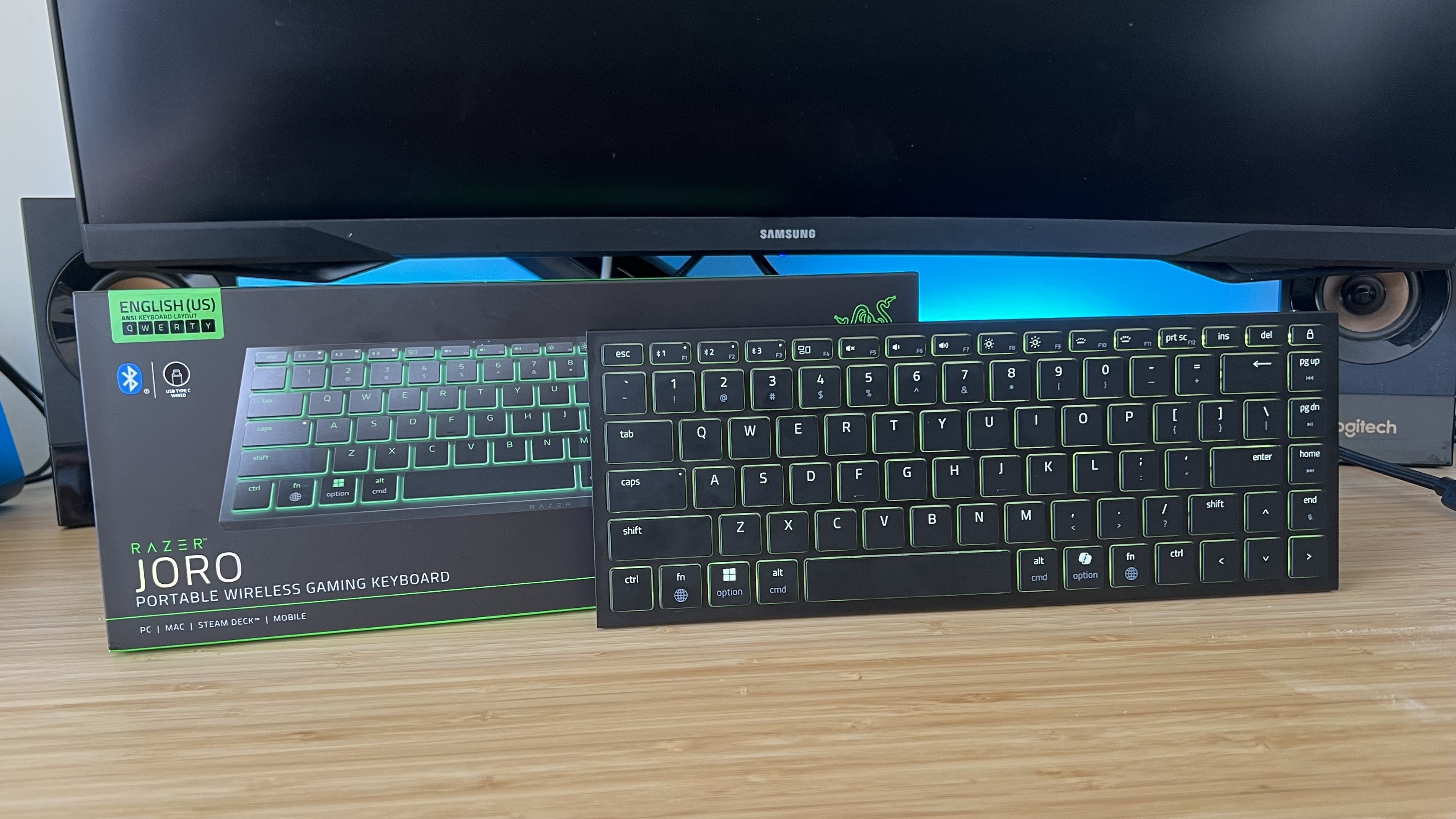 Razer Joro standing with packaging on a wooden desk
