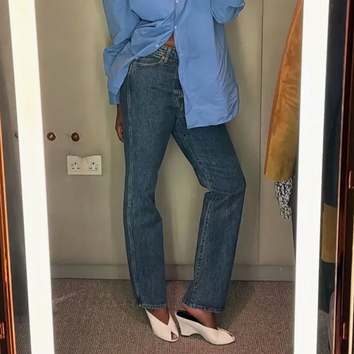 Woman in jeans and white wedges