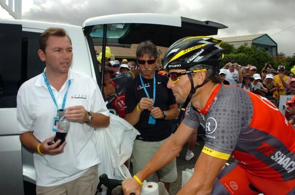 Johan Bruyneel and Lance Armstrong chat at the Tour Down Under
