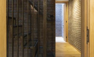 brick everywhere, walls, ceilings and floors at Southwark brick house by Satish Jassal