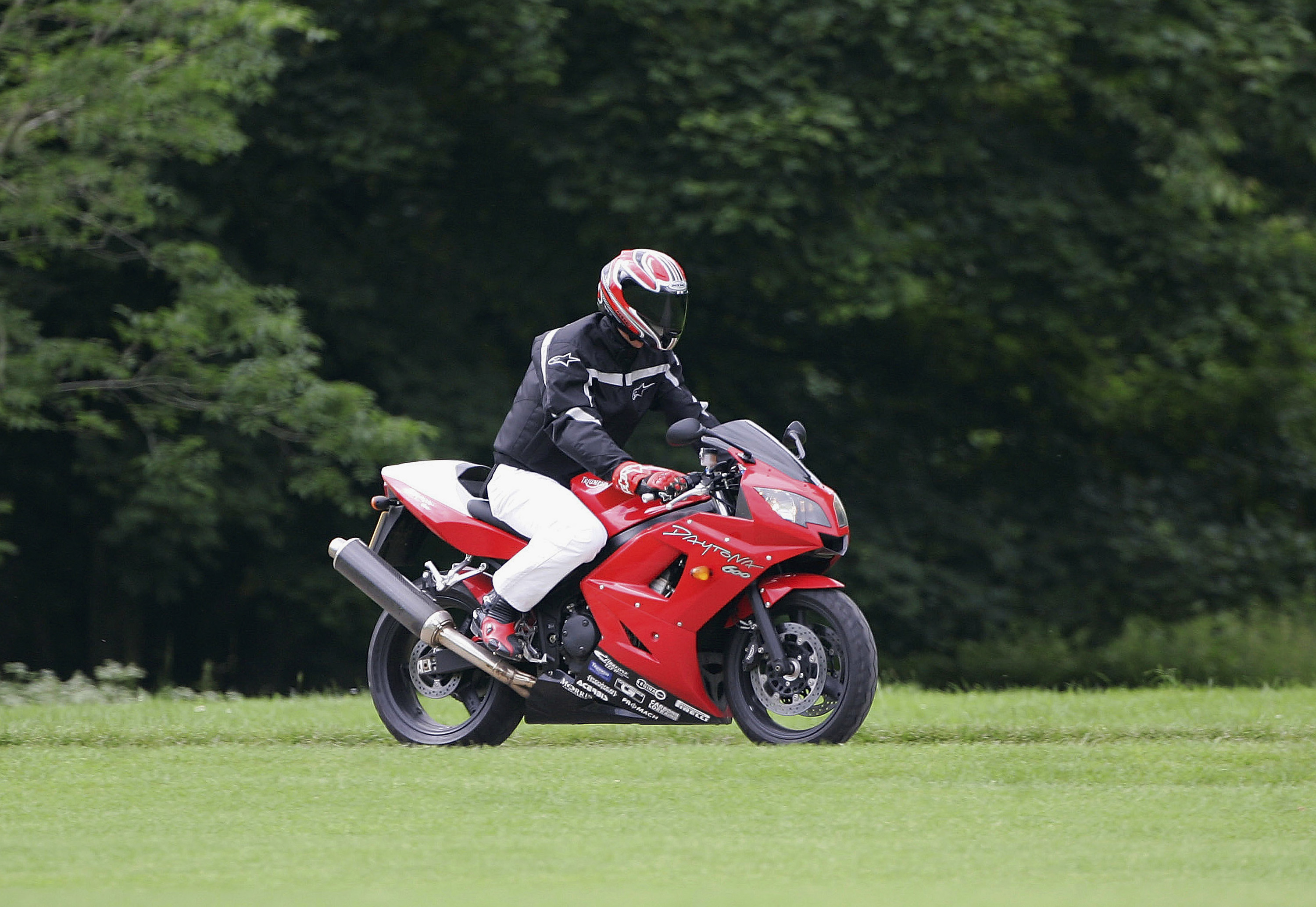 GLOUCESTERSHIRE, ENGLAND - JUNE 17: Prince William arrives at Cirencester Polo Club on a motorbike for a polo match in Gloucestershire on June 17, 2005, England. (Photo by Tim Graham/Getty Images)