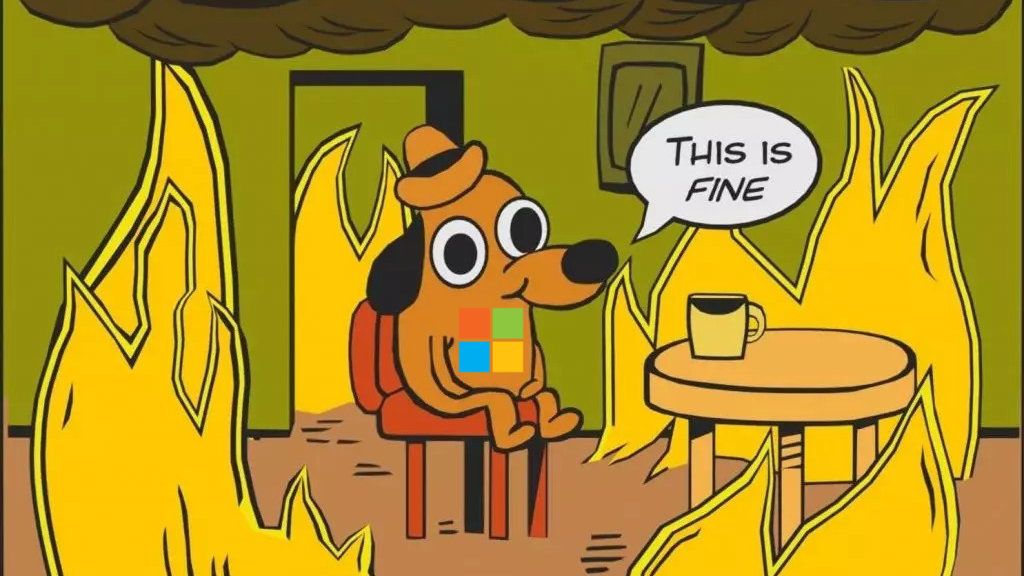 This is fine meme with the Microsoft logo on the dog surrounded by flames.