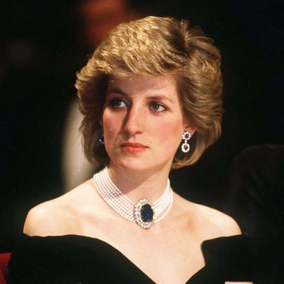 Princess Diana wears a blue sapphire and pearl choker with a black off-the-shoulder dress, and Princess Charlotte wears a white dress with a floral headband