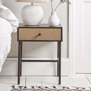 Cox & Cox Studio Bedside Table styled in white bedroom, white floors, lamp and vase