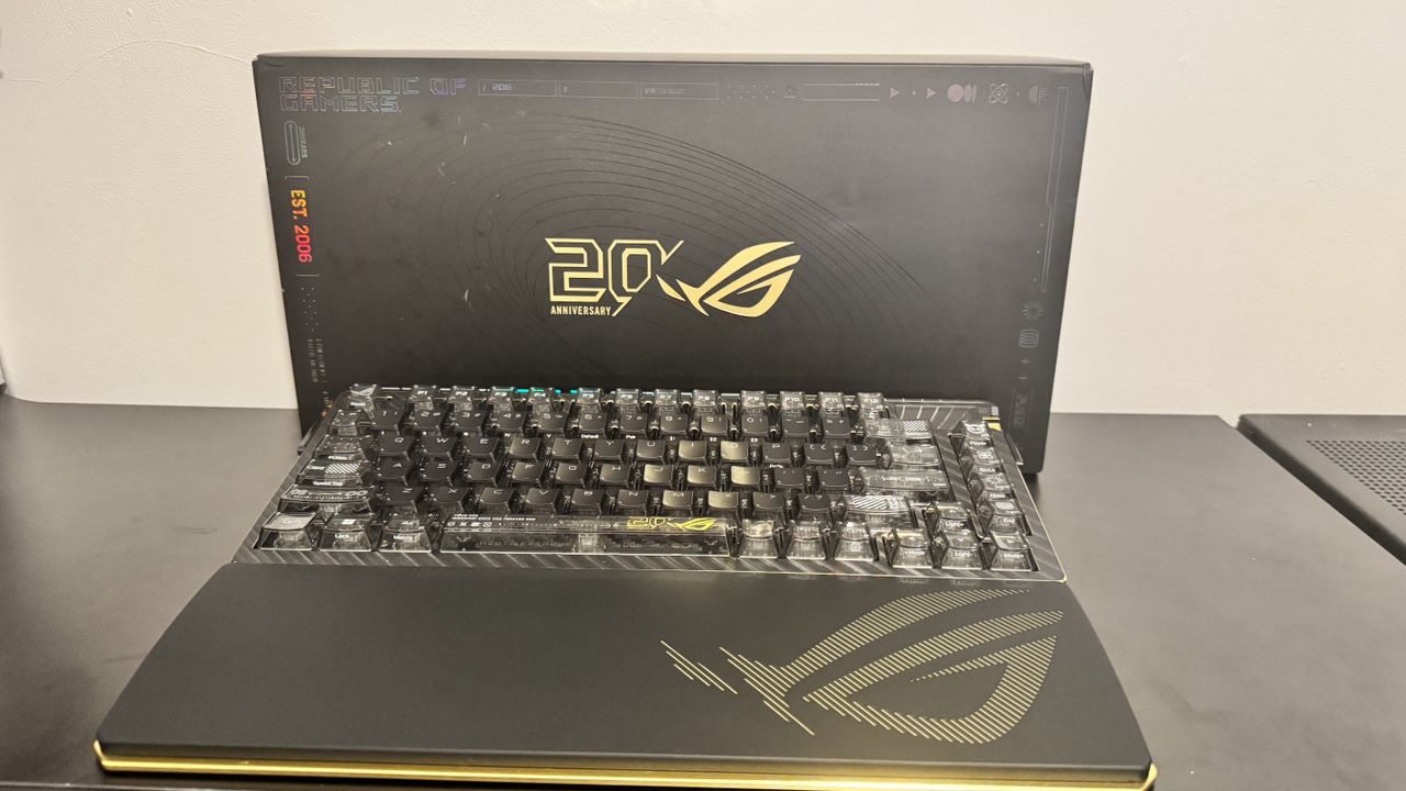 Asus ROG Azoth Extreme Edition 20 on a black table, with a box behind it
