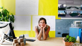 woman sitting at her desk