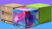 Three of dbrand's Steam Machine skins--from left to right, 'Package,' 'Cotton Candy,' and 'Touch Grass'.
