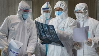 Doctors look at a lung CT image at a hospital in Yunmeng county, Xiaogan city, in China's central Hubei province in Feb. 20, 2020. 