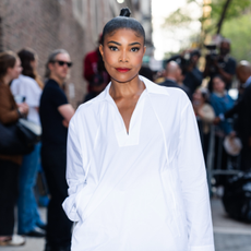 Gabrielle Union in red lipstick white shirt and ponytail