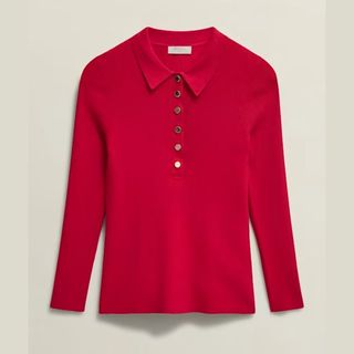 Cut out of a red knitted polo shirt by Hobbs against a beige background