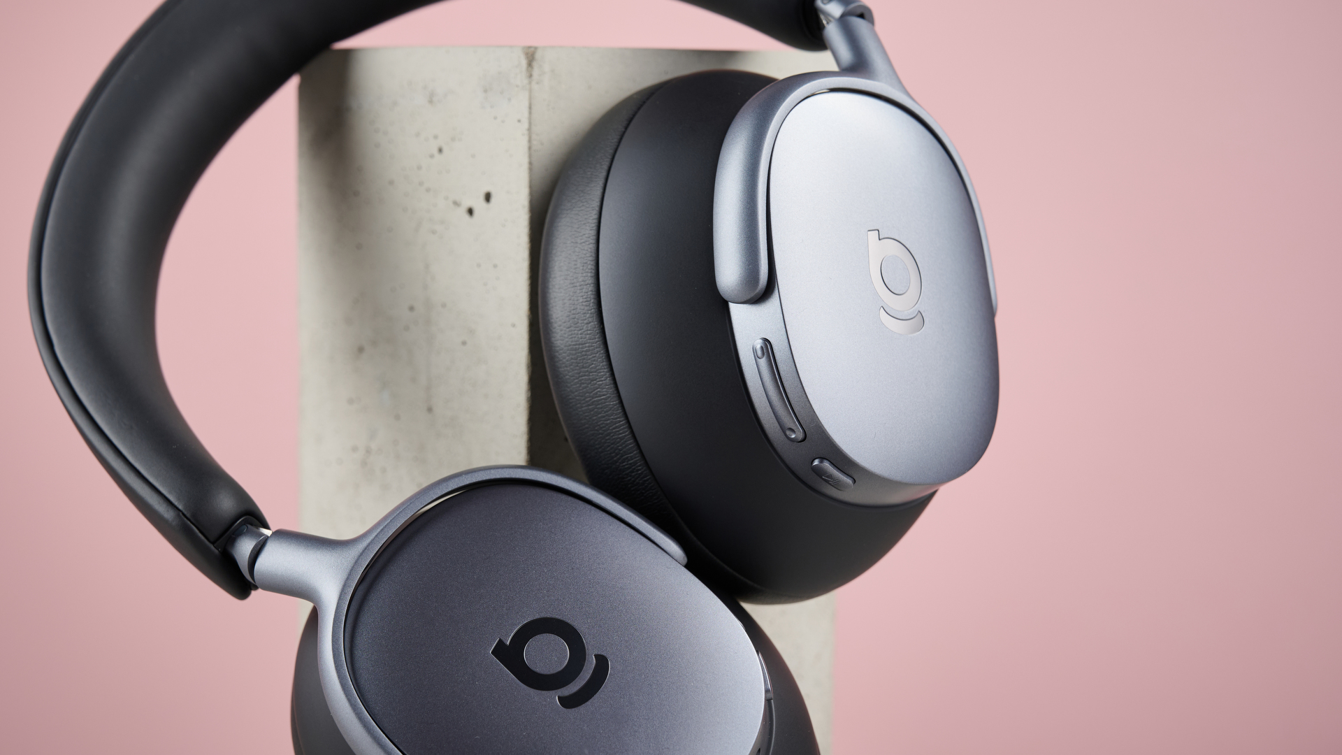 Baseus Inspire XH1 headphones against a pink background