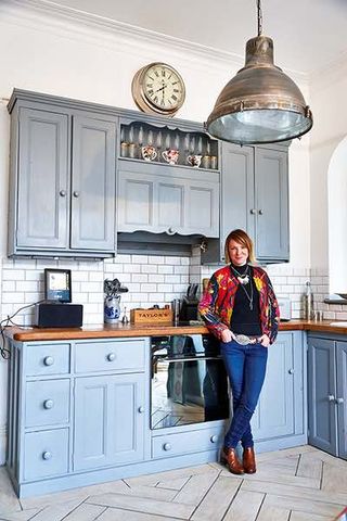 Apartment renovation blue kitchen with homeowner