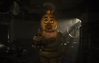 Chica the Chick in Five Nights at Freddy's holding a pink cupcake with a candle