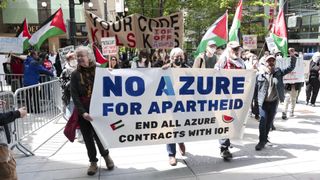Pro-Palestinian demonstrators hold banners and signs as they protest outside the Microsoft Build conference at the Seattle Convention Center in Seattle, Washington on May 19, 2025. (Photo by Jason Redmond / AFP) (Photo by JASON REDMOND/AFP via Getty Images) 