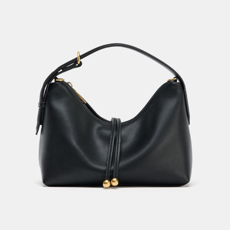 A cutout of a black small Zara handbag