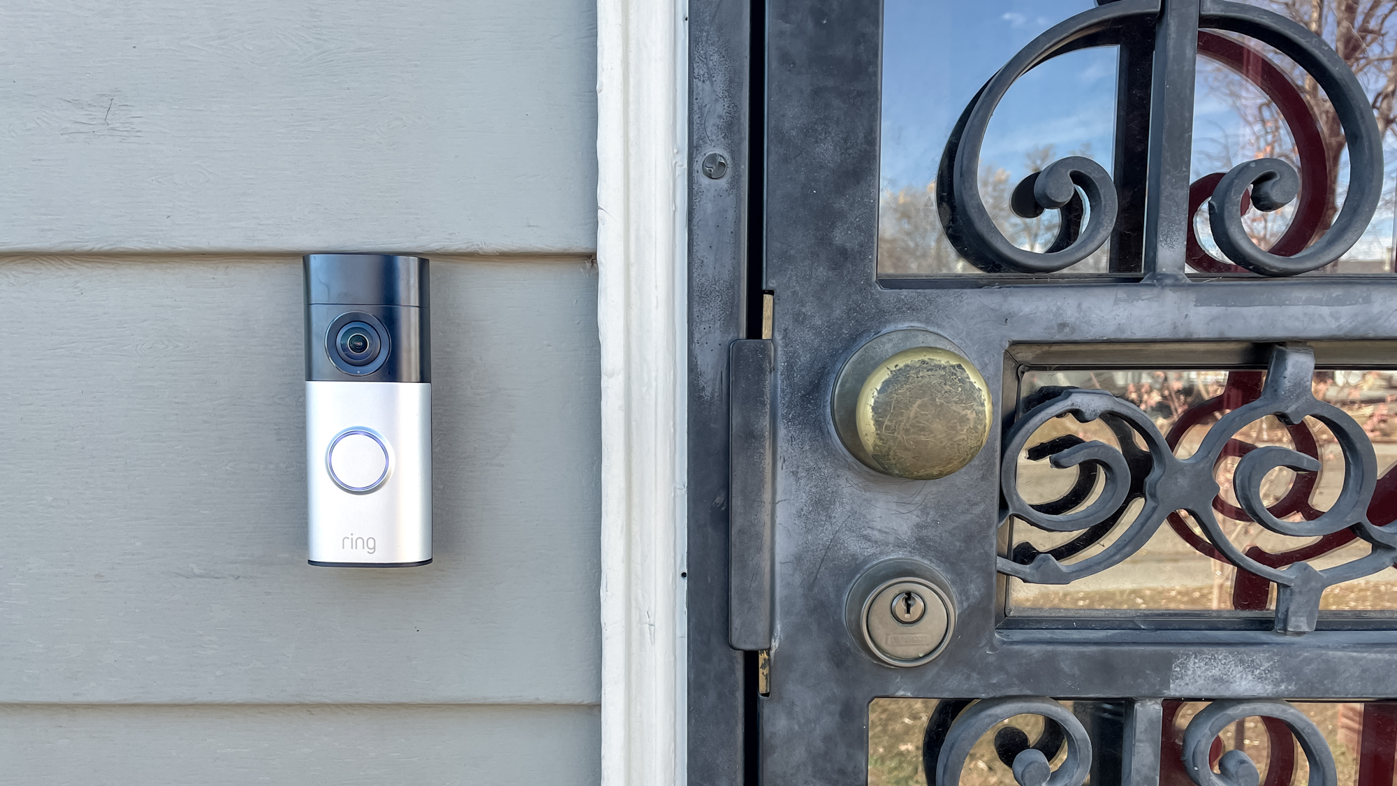 Ring Wired Doorbell Plus (2nd gen) mounted next to a front door