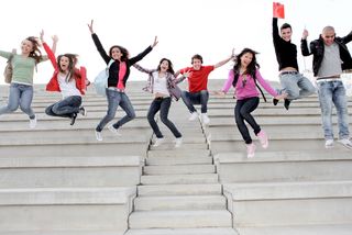 happy teens jumping