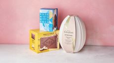 3 easter eggs against a pink background