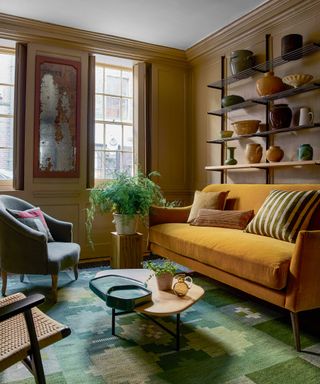 mustard and green living area with ouch and open shelving