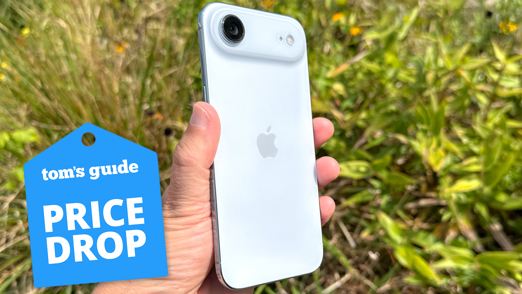 iphone air over grassy background with a price drop sticker