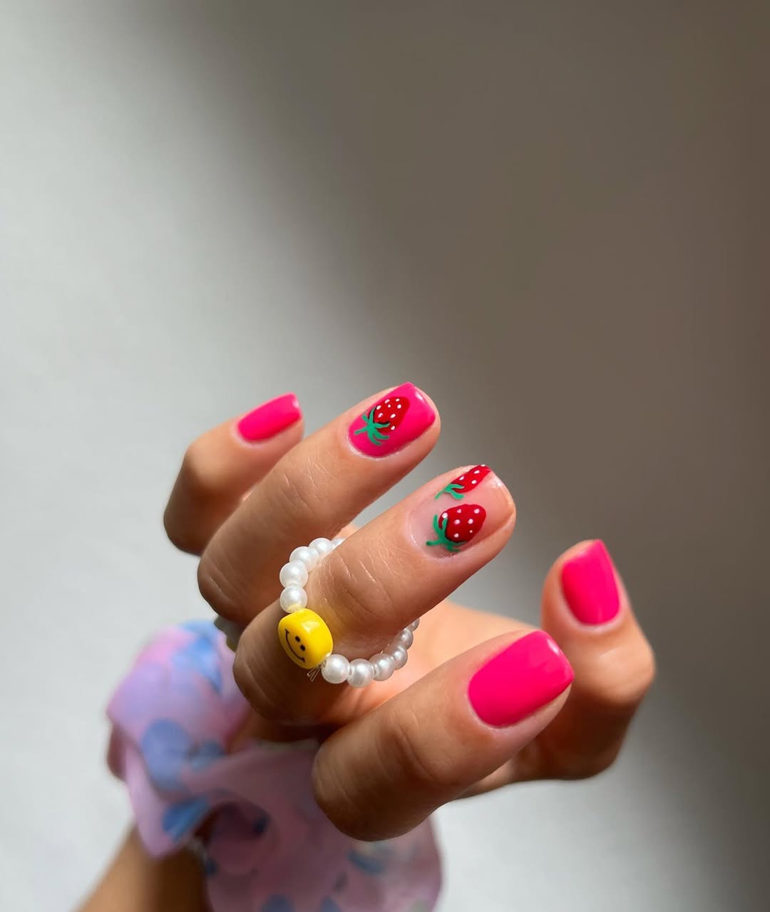 Pink nails with strawberry art by Hang Nguyen