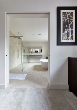 neutral bathroom with shower and glass area, vanity unit, tiled floor and walls, ensuite