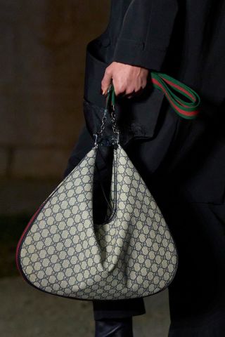 A printed Gucci Attache bag in Resort 2023