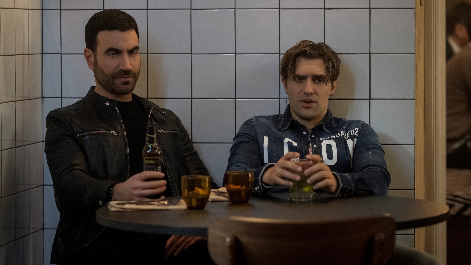 Brett Goldstein and Phil Dunster as Roy and Jamie having a drink together in Ted Lasso