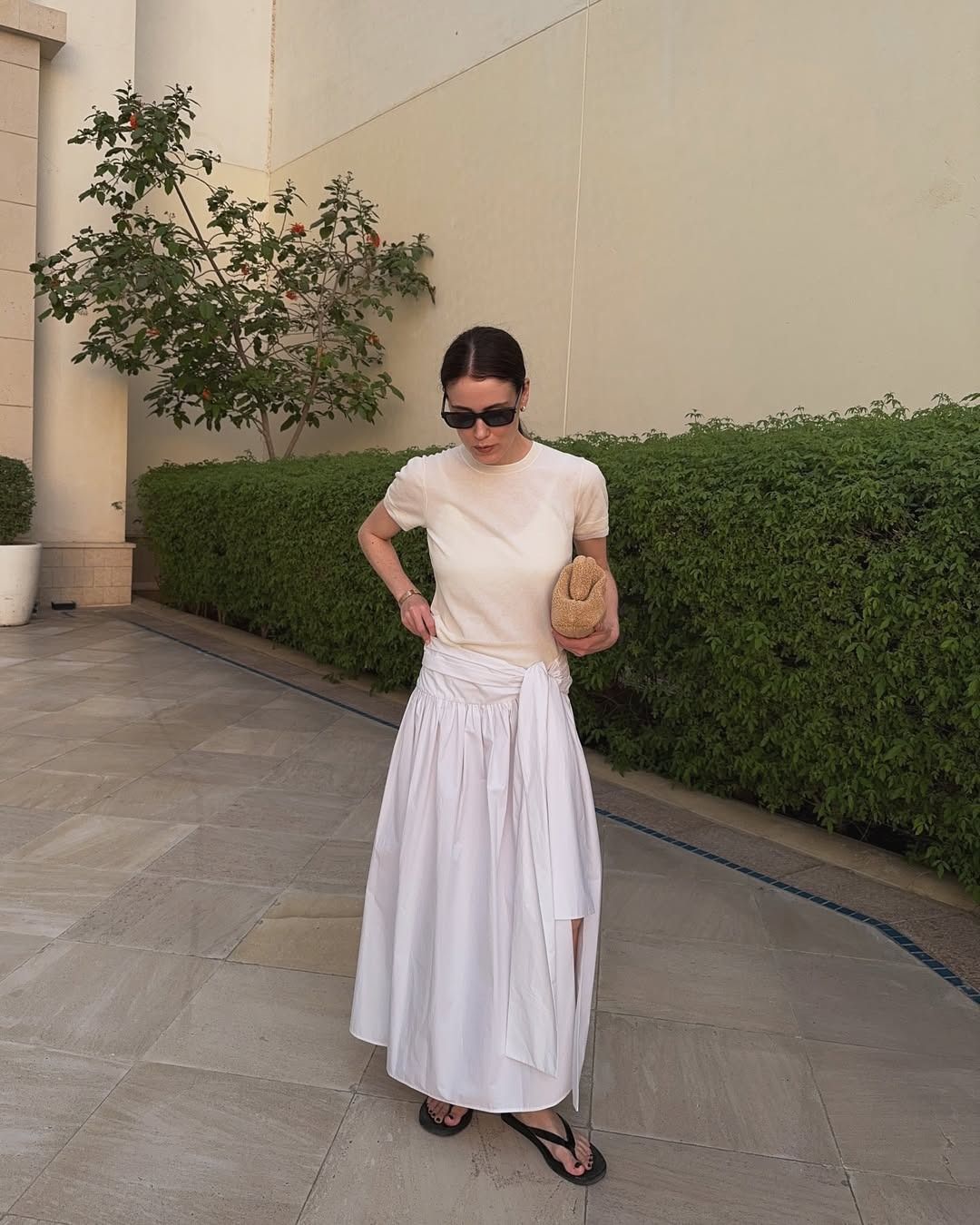 Influencer wearing a long full white maxi skirt