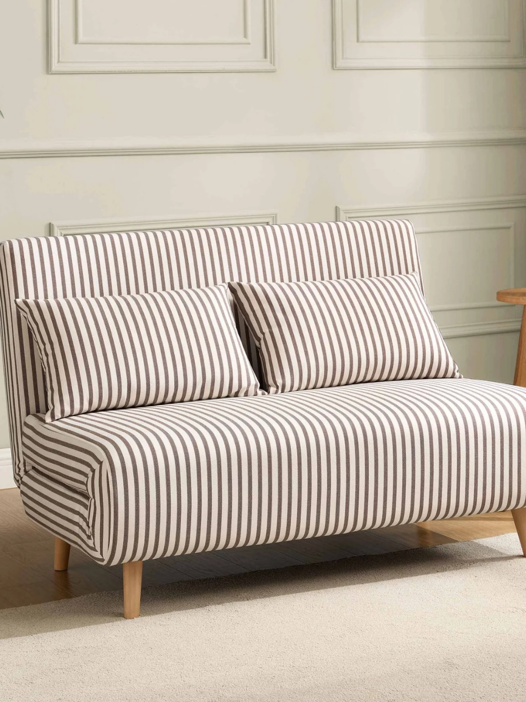 A pin-striped sofa bed