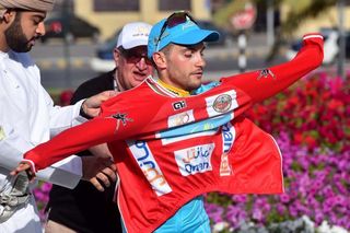 Andrea Guardini (Astana) pulls on red over his sky blue