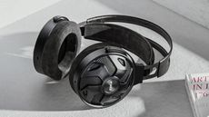 FiiO FT3 wired headphones resting on a grey surface