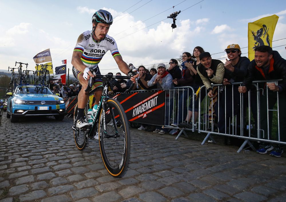 Peter Sagan rides to the finish after crashing near the end of Tour of Flanders