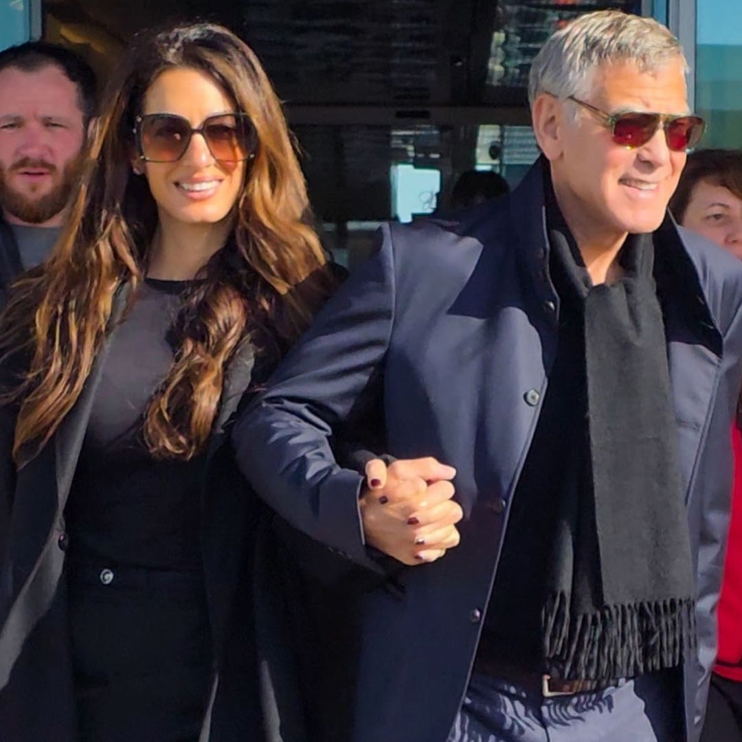 Amal Clooney arrived at the Olympics in Milan wearing leopard-print knee-high boots