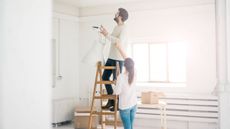 man and woman undertaking diy by getty images