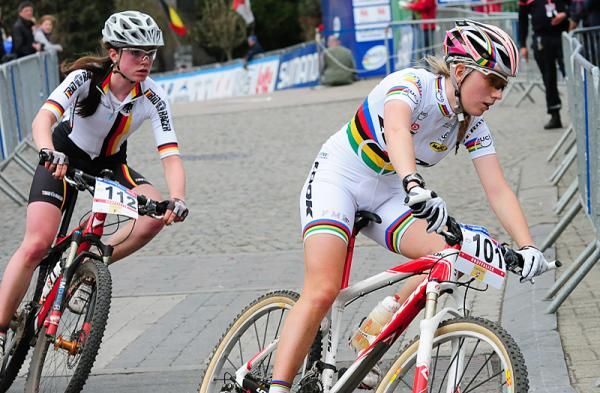Pauline Ferrand Prevot (France) leads with one lap to go.