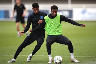 Marcus Rashford, left, during a training session at St George’s Park