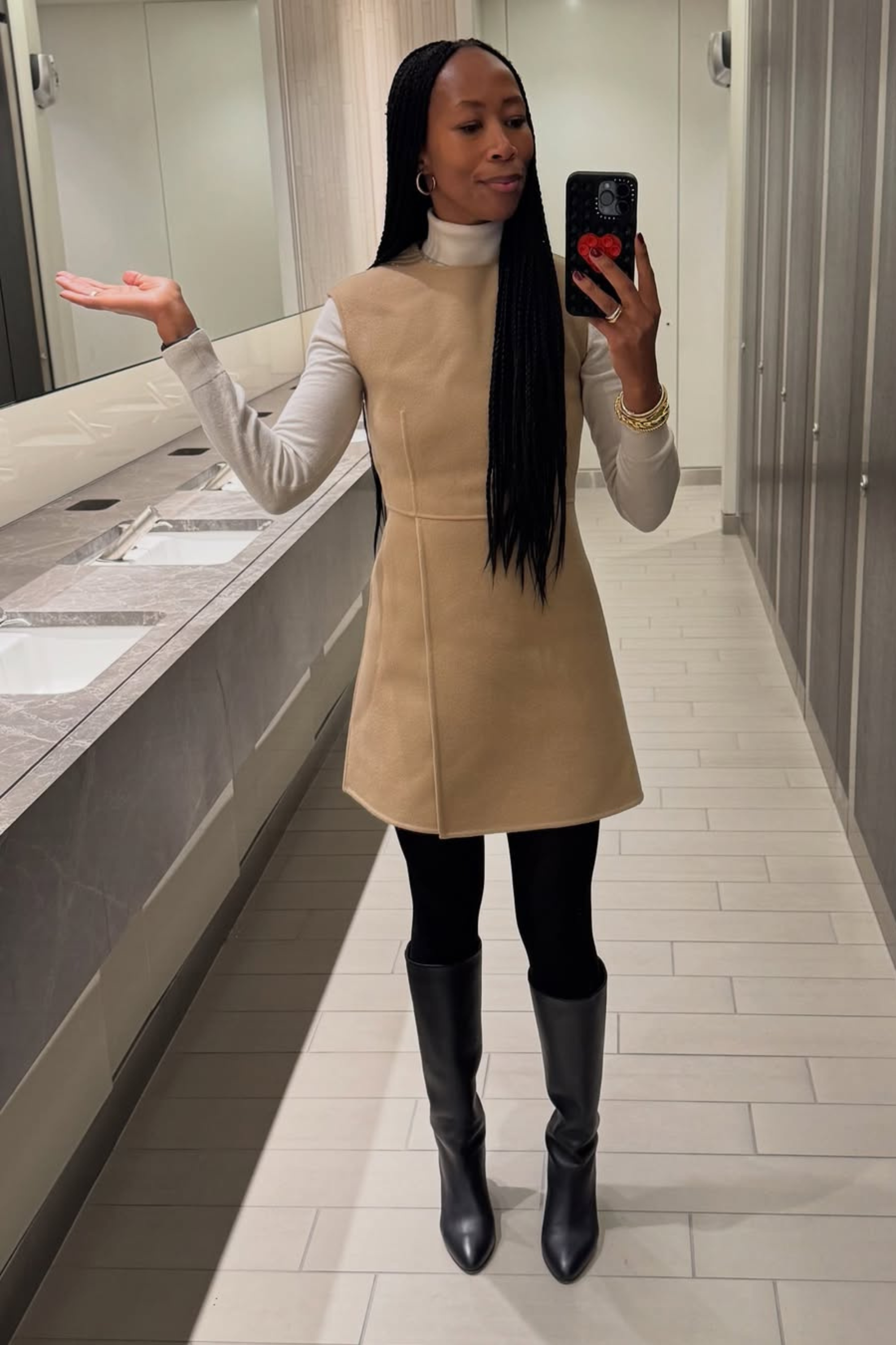 @thandimaq wears suede mini dress black tights