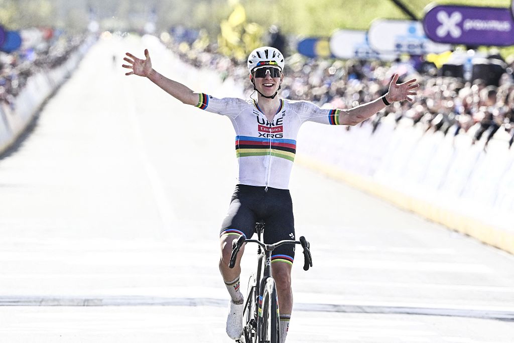 UAE Team Emirates' Slovenian rider Tadej Pogacar celebrates as he crosses the finish line to win the men's race of the 'Ronde van Vlaanderen/ Tour des Flandres/ Tour of Flanders' UCI WorldTour one day cycling race, 278 km from Antwerp to Oudenaarde, in Haaltert on April 5, 2026. (Photo by ERIC LALMAND / Belga / AFP) / Belgium OUT
