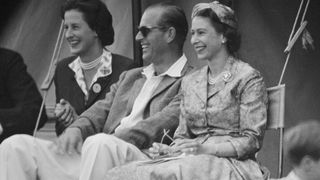 Queen Elizabeth II and Prince Philip, Duke of Edinburgh watch a cricket match at Highclere Castle, Highclere, Hampshire, 3rd August 1958.