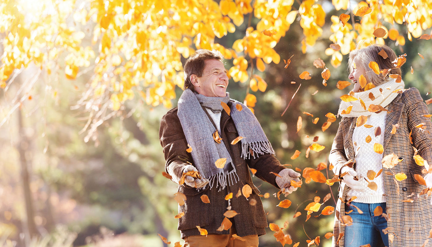 Active seniors on a walk in autumn town