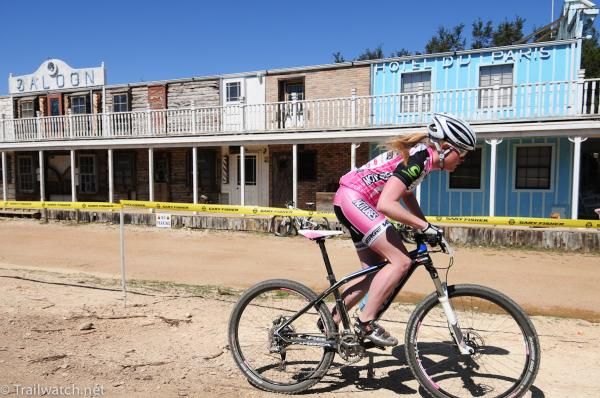 Kaila Hart (NoTubes Elite Women's Team) passes by the old western town
