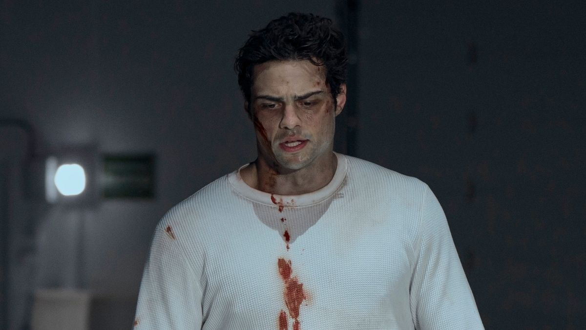 Owen with blood on his sweater and face in The Recruit Season 2