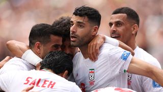 Iran's Mehdi Taremi celebrating with teammates at World Cup 2026