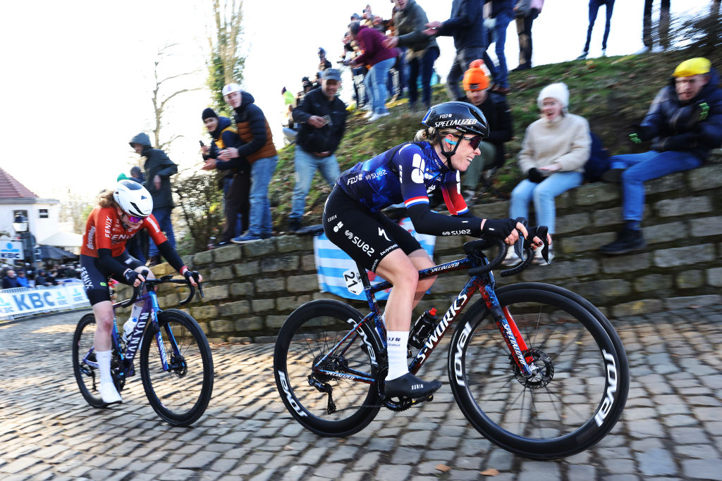 NINOVE, BELGIUM - MARCH 01: (L-R) Puck Pieterse of Netherlands and Team Fenix-Deceuninck and Demi Vollering of Netherlands and Team FDJ - Suez compete in the breakaway climbing the Muur van Geraardsbergen while fans cheer during the 17th Omloop Het Nieuwsblad 2025, Women&amp;apos;s Elite a 137.9km one day race from Ghent to Ninove / #UCIWWT / on March 01, 2025 in Ninove, Belgium. (Photo by Rhode Van Elsen/Getty Images)