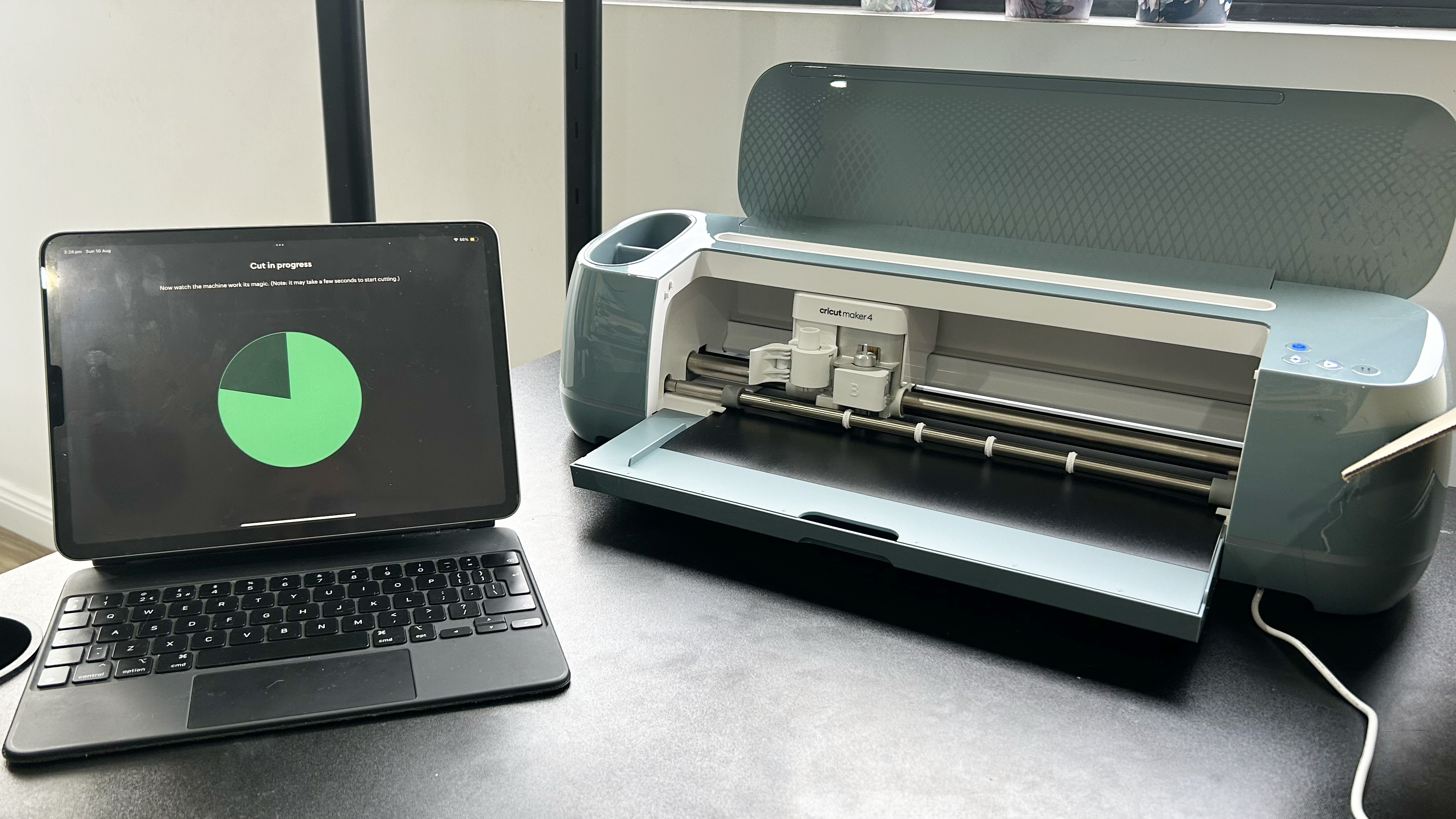 Cricut Maker 4 and iPad making cut on black vinyl