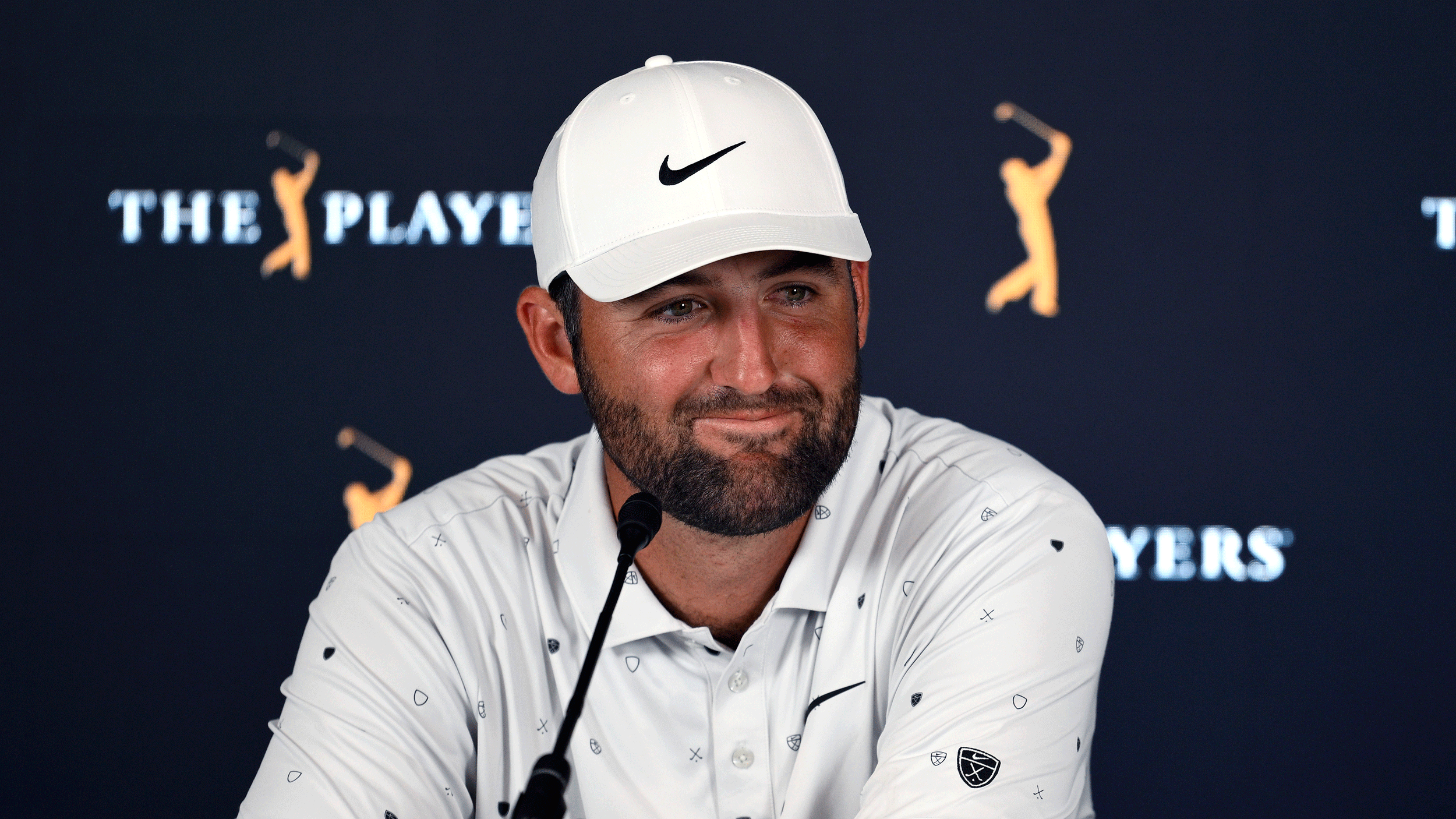 Scottie Scheffler smiles during his pre-Players Championship press conference in 2026